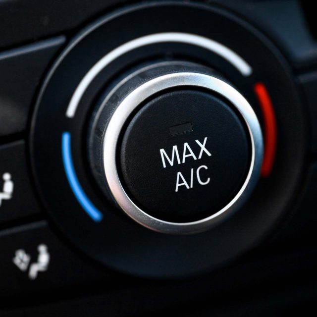 Color detail with the air conditioning button inside a car